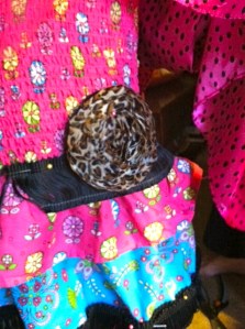 Draping the fabric and pinning the flower and fringe.