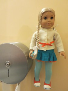 There's a holder for your doll in the bathroom stall so that she can watch you pee. Not weird at all.