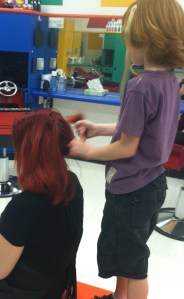 C.J. doing Miss. Crystal's hair.